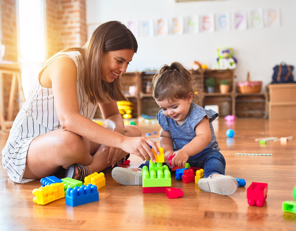 Woman and child playing with blocks