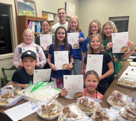 Youth displays breads they made