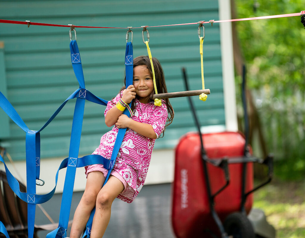 girl playing on a jungle gym