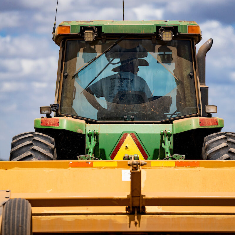 close view of a man in a tractor